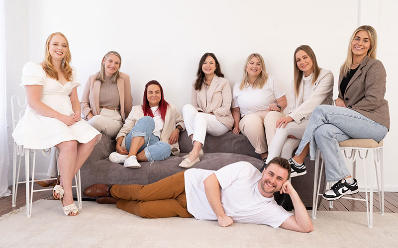 The Matchsticks Marketing Agency Team posing on a couch.